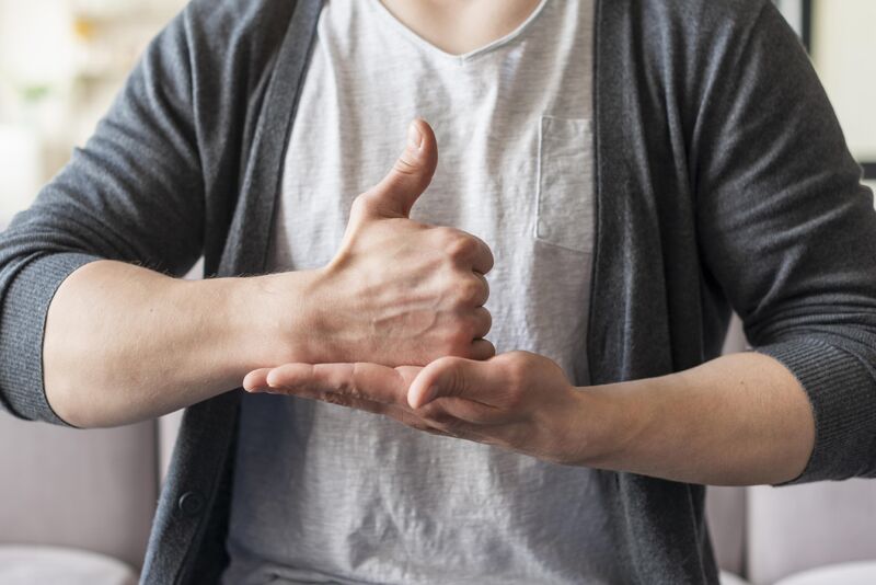 a person make a thumbs up with one hand and put it in the flat palm of the other hand
